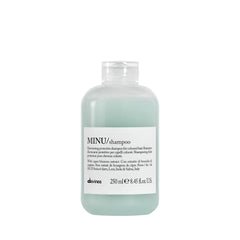 Davines MINU shampoo bottle highlights color protection benefit.