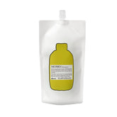 Davines MOMO Shampoo bottle promotes gentle cleansing and lasting hydration for dry hair
