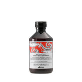 Davines Naturaltech Energizing Shampoo bottle close-up highlighting caffeine phytoceuticals for scalp vitality