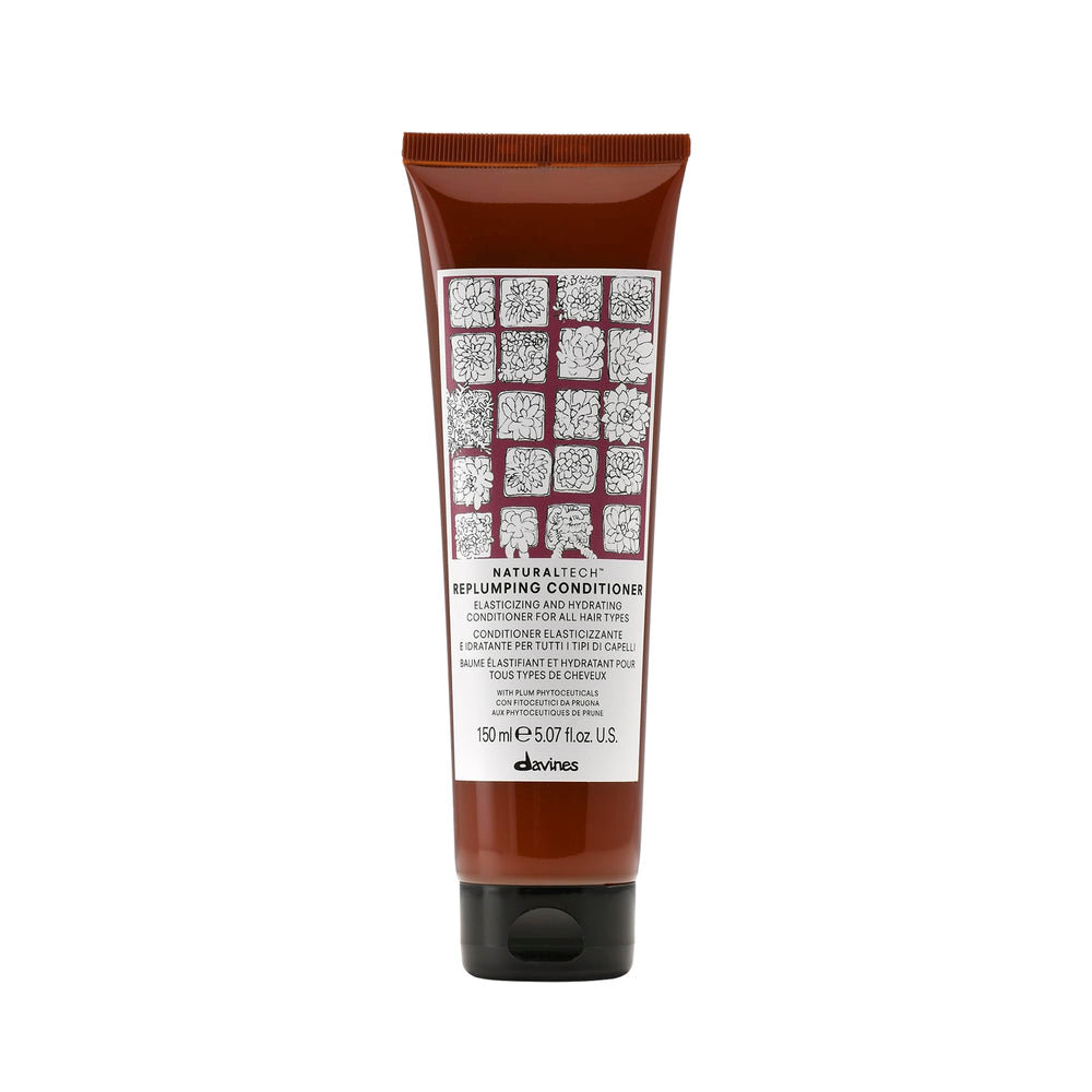 Davines Naturaltech Replumping Conditioner bottle boosts elasticity and detangles.