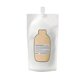 Davines NOUNOU Shampoo bottle close-up highlighting hydration for treated hair.