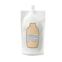 Davines NOUNOU Shampoo bottle close-up highlighting hydration for treated hair.