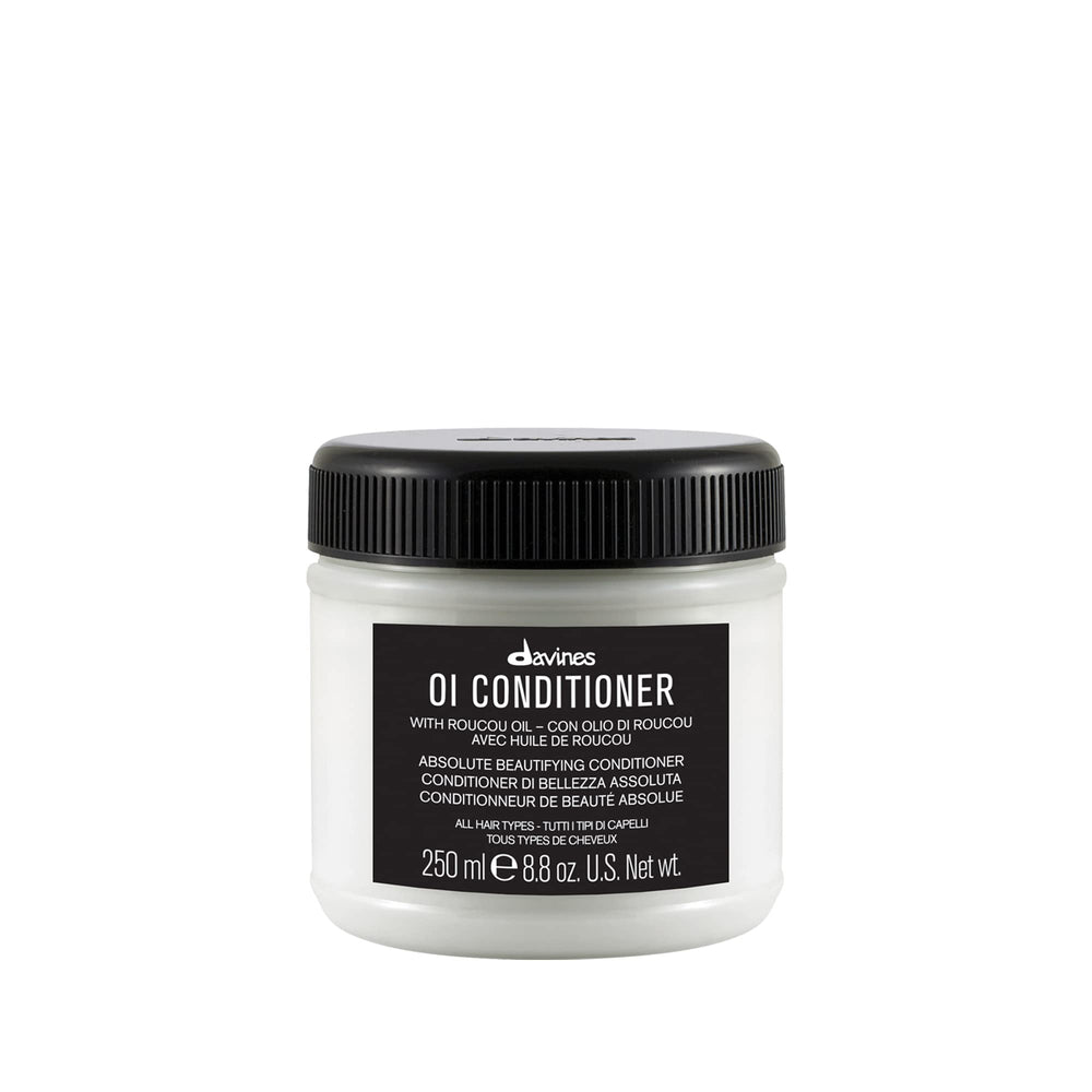 Davines OI Conditioner bottle side view shows smoothing care for hair