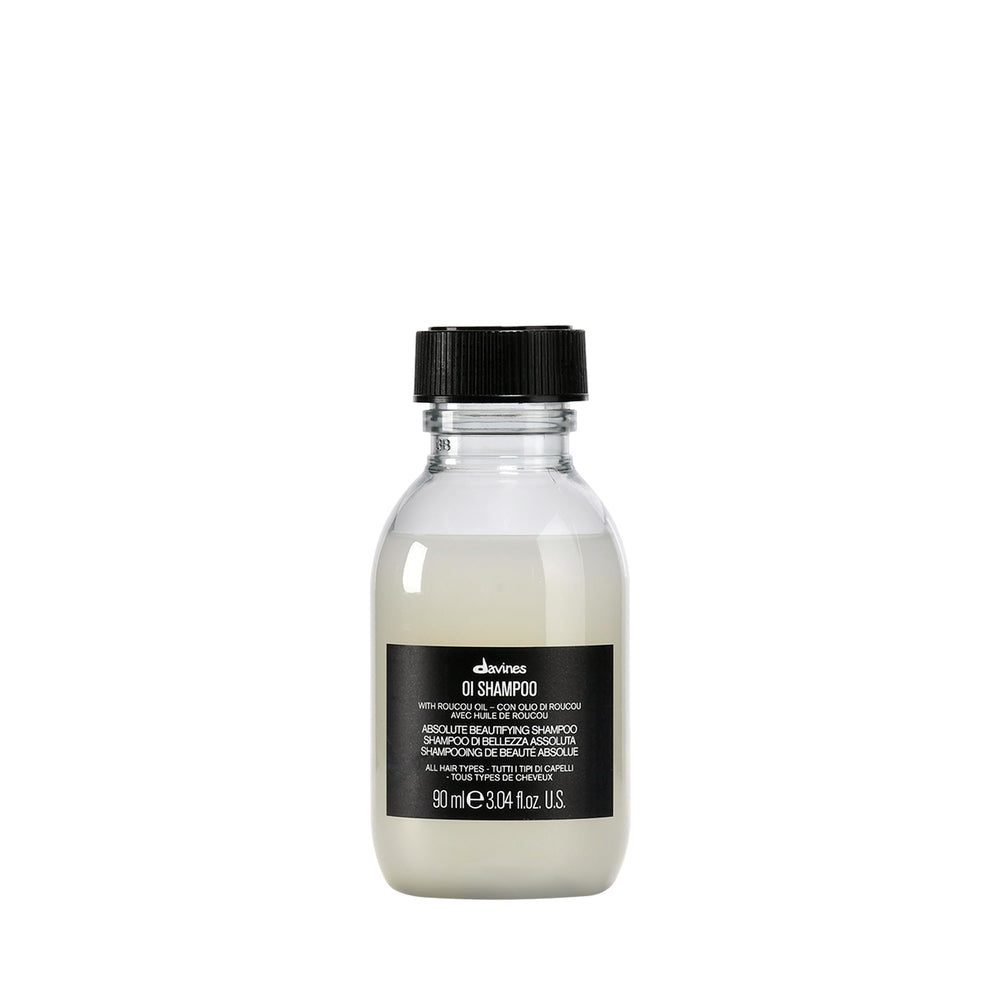 Davines OI Shampoo bottle pour showing milky texture for daily hydration