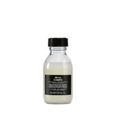 Davines OI Shampoo bottle pour showing milky texture for daily hydration
