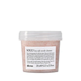 Davines SOLU sea salt scrub cleanser bottle close-up, highlighting cleansing action for the scalp.