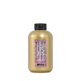 Davines This Is A Curl-Building Serum bottle showing defined curls