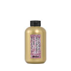 Davines This Is A Curl-Building Serum bottle showing defined curls