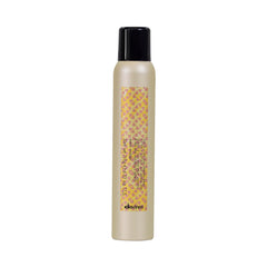 Davines This Is A Dry Wax Finishing Spray for controlled undone texture.