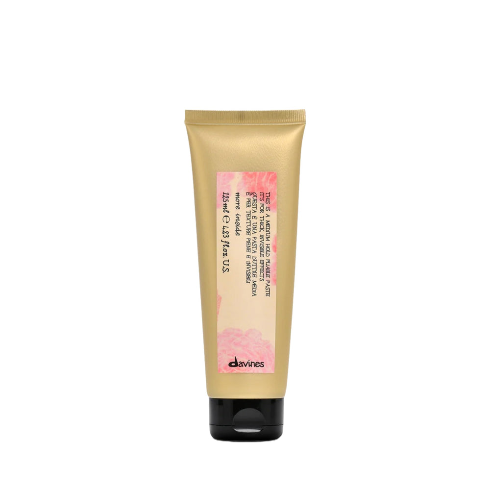 Davines This Is A Medium Hold Pliable Paste packaging shows a sleek jar for versatile styling