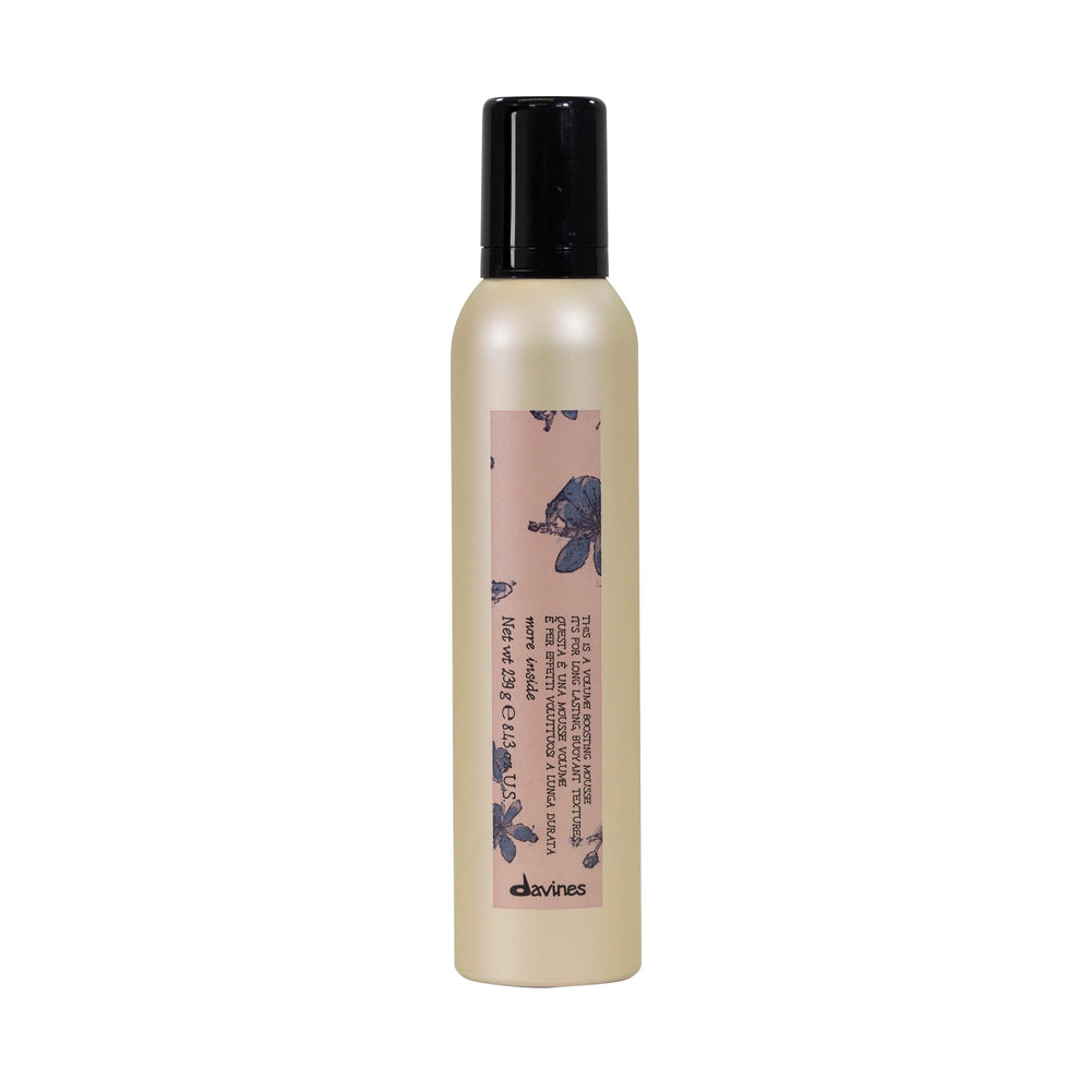 Davines This Is A Volume Boosting Mousse bottle provides airy lift for all hair types.