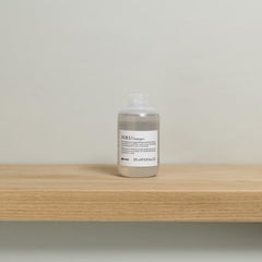 Davines VOLU shampoo foamy lather indicates gentle lift for fine hair.