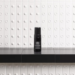 Davines OI Soufflé in hand showing liquid-to-foam transformation