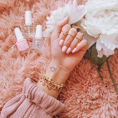Dazzle Dry Livin' La Vida Yoga soft pink lacquer close-up on nails