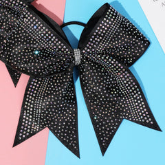 Bright glitter and rhinestones add sparkle to cheerleader ponytails