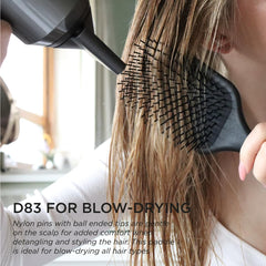 Denman paddle brush detangling wet hair with minimal tugging.