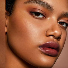 Depuplum Black Berry Lipstick with glossy finish for hydrated, radiant lips.