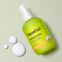 DevaCurl Moisture Seal spray application demonstrates even mist for frizz control.