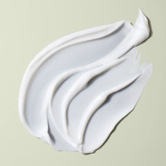 DevaCurl Decadence conditioner being applied for detangling and frizz control.