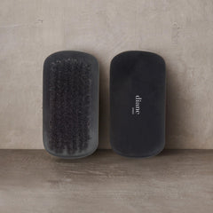 Diane boar bristle curved brush wave-styling close-up for deeper wave definition.