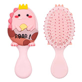 Dinatis toddler detangler brush with dinosaur pattern back for gentle grooming.