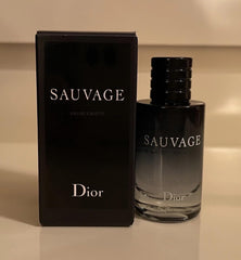 Dior Sauvage mini EDT cap detail, premium finish for a luxury travel scent