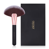 Docolor fan brush with soft bristles for gentle makeup application.