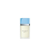 Dolce&Gabbana Light Blue bottle on a sunlit beach, ideal for daytime wear