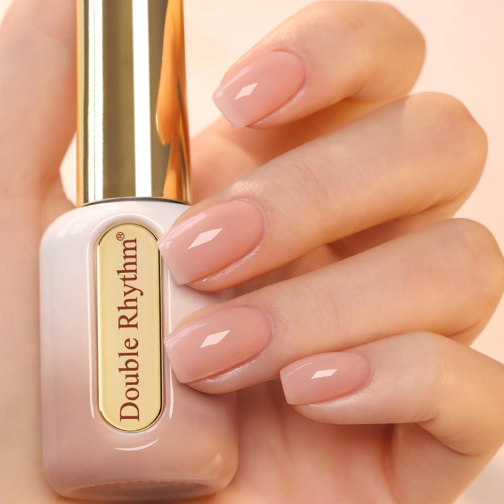 Double Rhythm nude pink gel polish bottle in round shape for at-home manicures.