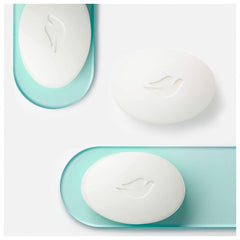 Dove bath bars stacked, six bars, ready for daily use with a soft, moisturizing formula.