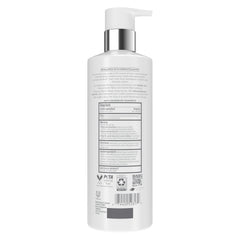 Close-up of Dove Derma Scalp Shampoo label highlighting salicylic acid benefits