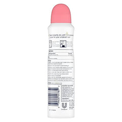 Applying Dove Rose Petals dry spray underarm for quick-dry feel