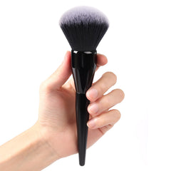 dpolla Large Powder Brush blending close-up for a natural finish.