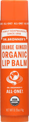 Dr. Bronner's lip balm tube with orange-ginger scent for portable moisture.