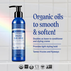 Hands applying Dr. Bronner's Peppermint Hair Creme for smooth, frizz-free styling.