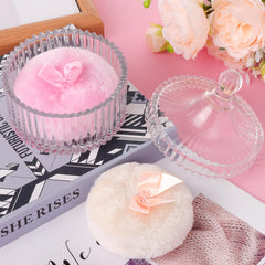 Draupnir large dusting puff in use for body powder.