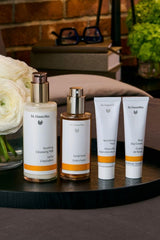 Applying Dr. Hauschka Facial Toner to neck and décolleté