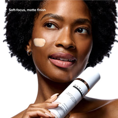 DRMTLGY Matte Universal Tinted Moisturizer swirl on skin shows sheer, breathable coverage.
