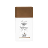 Drunk Elephant D-Bronzi Sunshine Drops bottle showing a bronze glow for sun-kissed complexion