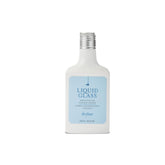 Drybar Liquid Glass Smoothing Conditioner bottle pour showing frizz control and shine