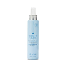 Drybar Liquid Glass bottle sealant shields hair for a sleek, frizz-resistant look.
