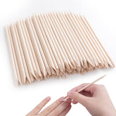 DF DualFERV orange sticks for nails with natural wood finish for precise cuticle work.