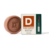 Duke Cannon Bar Soap Puck in hand shows durable, round design for an easy grip.