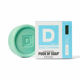 Duke Cannon Midway bar soap puck unwrapped showing rugged disc for daily cleansing.