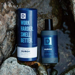 Duke Cannon Huron bottle cap close-up with rugged, masculine appeal.