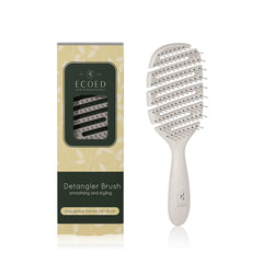 Ecoed Detangler brush with soft bristles gently removes knots for smooth hair