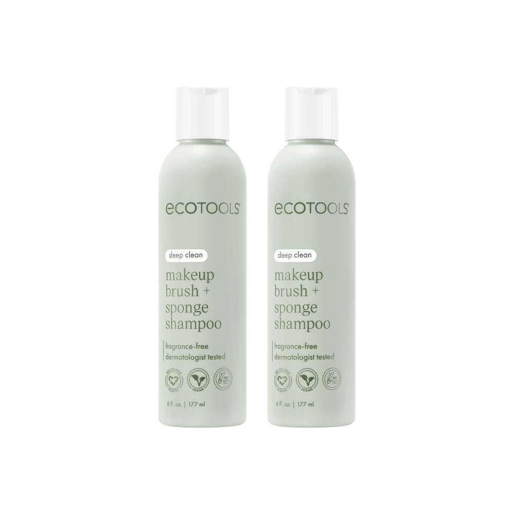 EcoTools brush shampoo two bottles on a clean vanity for smoother makeup application.