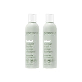 EcoTools brush shampoo two bottles on a clean vanity for smoother makeup application.