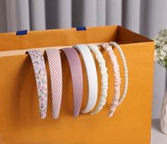 Eleilians pearl floral headband detail adds feminine charm.