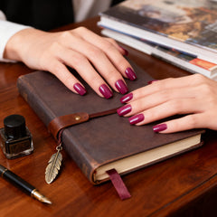 Closeup of Elevenail dark rose pink nails showing rich color and gloss